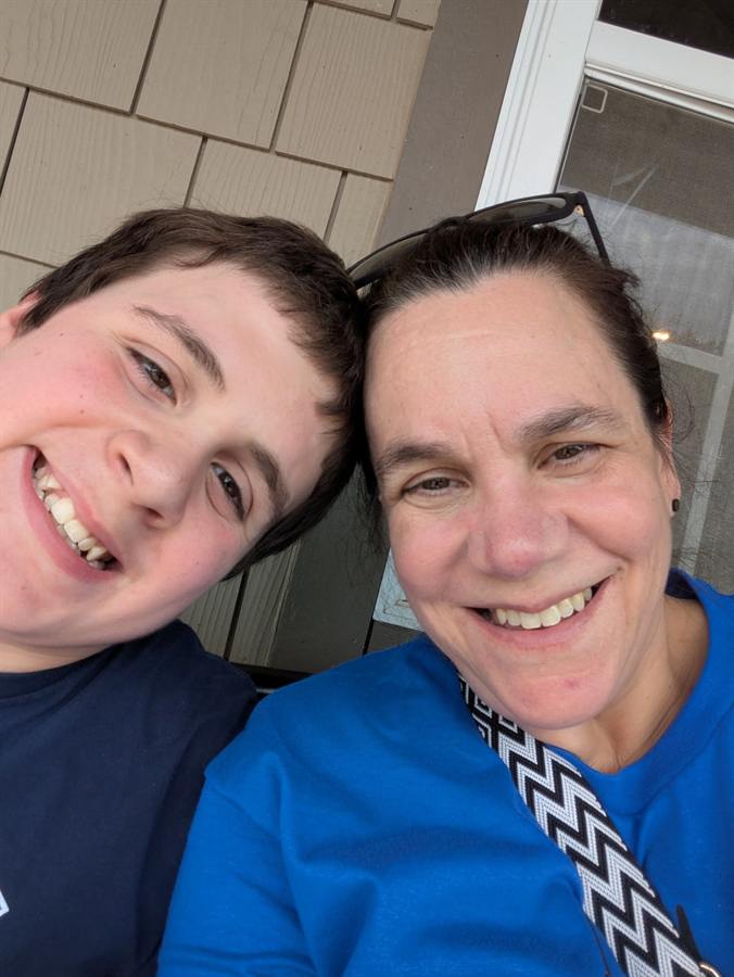 Two people smiling together in a close-up selfie